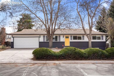Ranch-style house featuring a garage, brick siding