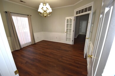 Unfurnished room featuring dark wood-type flooring