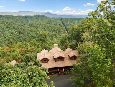 Birds eye view of property with a wooded view and 
