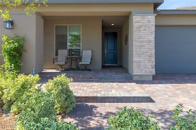 Doorway to property with stucco siding, stone sidi