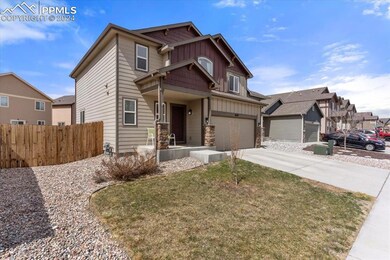 Craftsman-style home featuring a front yard and a 