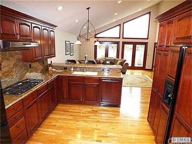 View including refrigerator with cherry panels