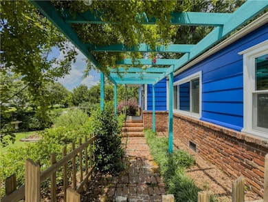 View of patio with a pergola and stairs