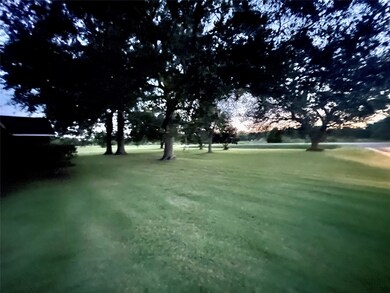 Front yard view with beautiful mature shade trees