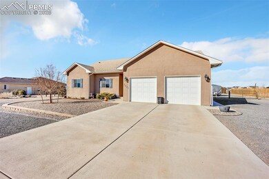 Ranch-style home with concrete driveway, an attach