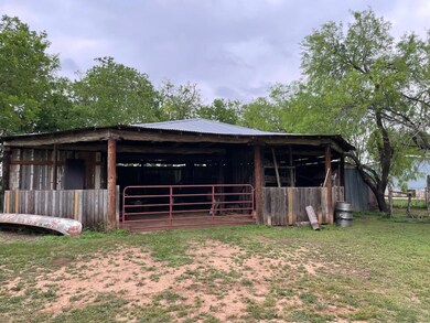 View of outbuilding with an exterior structure