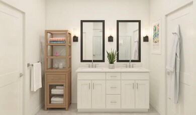Primary bath with sconce lighting and black-framed mirrors