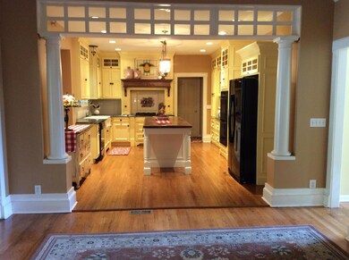 This one-of-a-kind farmhouse kitchen has an open concept into the living room and is perfect for entertaining guests.