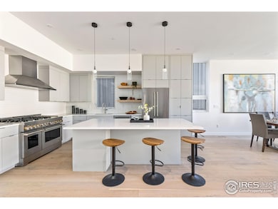 Beautiful kitchen with double oven, gas range+griddle, microwave drawer, designated coffee station with water line