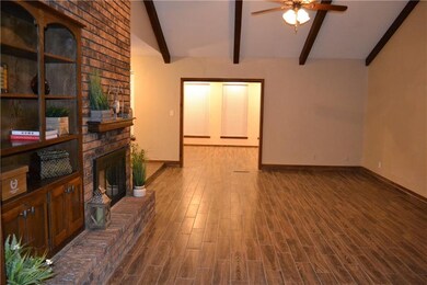Living room opens to the sunroom.  New wood-look c
