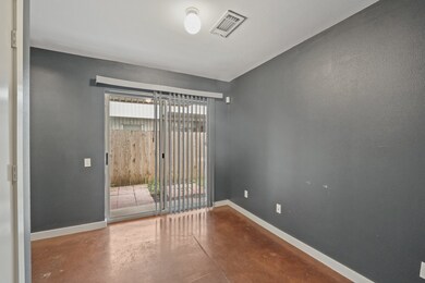 Bedroom 1 with access to the back yard.