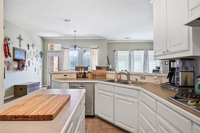 Kitchen with sink, stainless steel appliances, whi