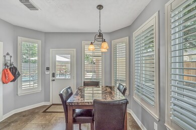 LIGHT AND BRIGHT BREAKFAST AREA - is located adjacent to the kitchen and family room.