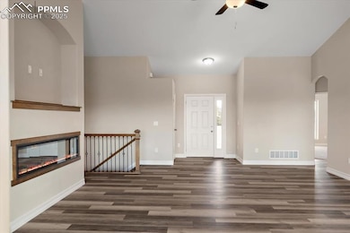 Entryway with ceiling fan, wood finished floors, v