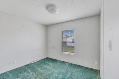 This room features a simple design with white wall