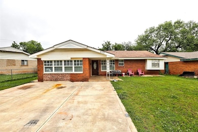 Ranch-style home with brick siding