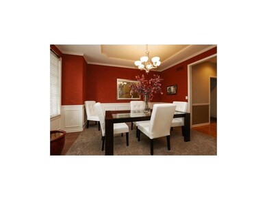 Formal dining area opens towards kitchen area