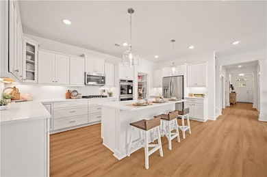 PHOTO IS OF DECORATED MODEL AND SAME FLOORPLAN AS SUBJECT 43 ENGLISH BARN WAY.  Finishes and Features do vary but just as beautiful.