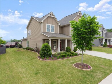 Craftsman-style house featuring a porch, a front l