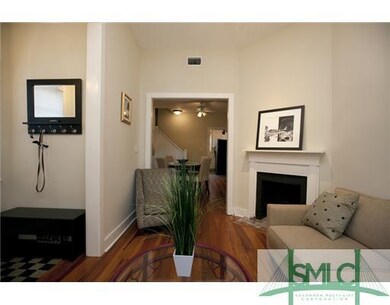 Living Room. Entry foyer is to the left. Downstair