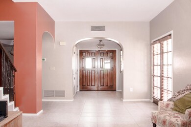 Living room looking into entryway