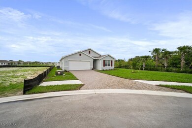 Ranch-style home with driveway and an attached garage