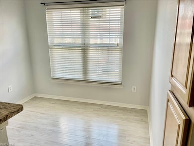 Empty room featuring light hardwood / wood-style f