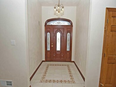 Entry/Foyer. Decorative tile and high ceiling in s