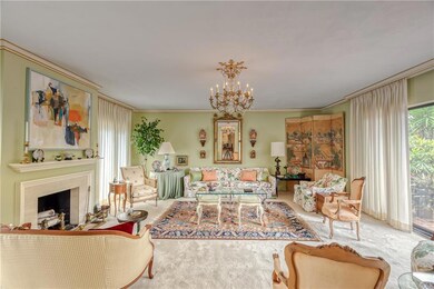 Second living area with fireplace and carpet floor
