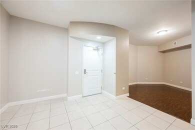 Spare room featuring visible vents, baseboards, an