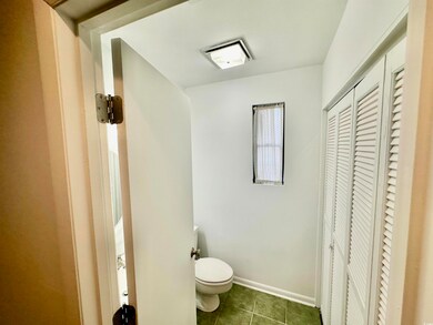 Bathroom with tile patterned floors and toilet