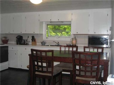 Kitchen. Eat in kitchen with ample cabinets.