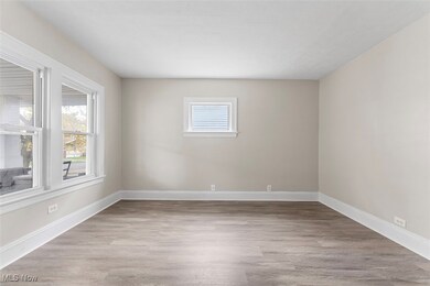 Spare room with light hardwood / wood-style flooring