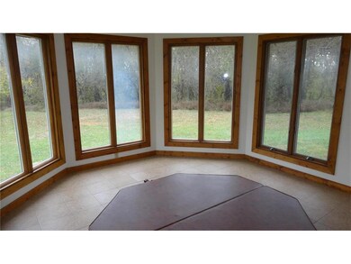 Sun room and hot tub. Hot tub can be accessed from