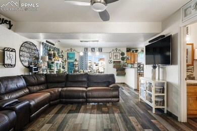 Living room featuring dark wood-type flooring and 
