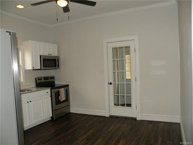 Kitchen, view from hallway showing dining area and