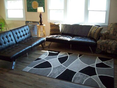 WIDE OPEN WITH BEAUTIFUL LAMINATE FLOORS!