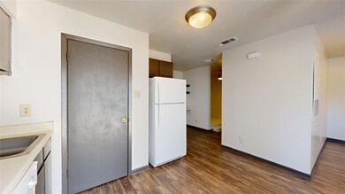 Kitchen featuring dark hardwood / wood-style floor