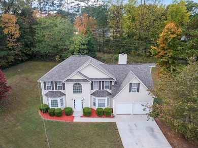 Traditional-style house with driveway, a front yar