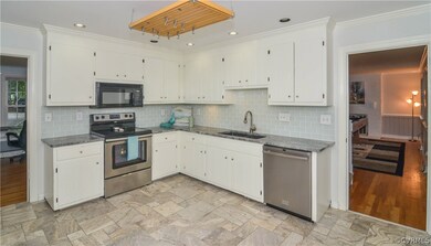 This kitchen features stainless steel appliances.