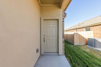 Entrance to property featuring stucco siding