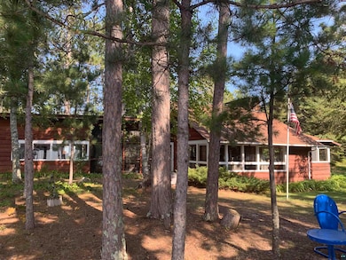 View of yard with a sunroom