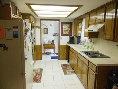 Kitchen, looking towards front entry.  Dishwasher,