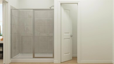 Bathroom featuring a shower with shower door