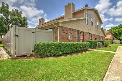 View of side of property with a lawn