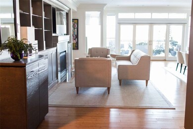 Living room w/beautiful custom built-ins and gas f
