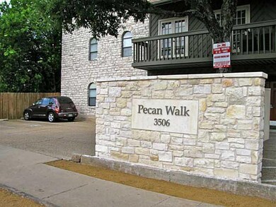 Community sign with uncovered parking