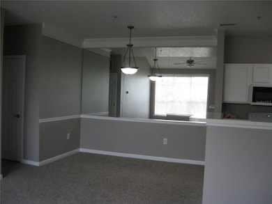 DINING RM. WITH MIRRORED WALL.