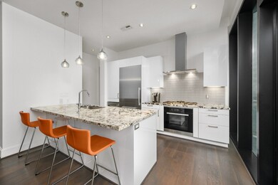 This spacious kitchen features large windows, high