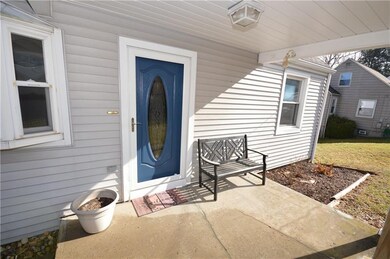 Covered front porch door leads to living room
